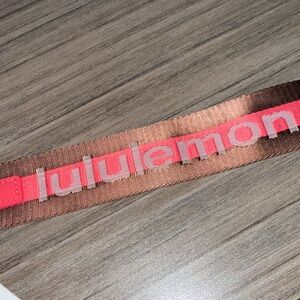 Lululemon Brown and Red Never Lost Keychain NWT